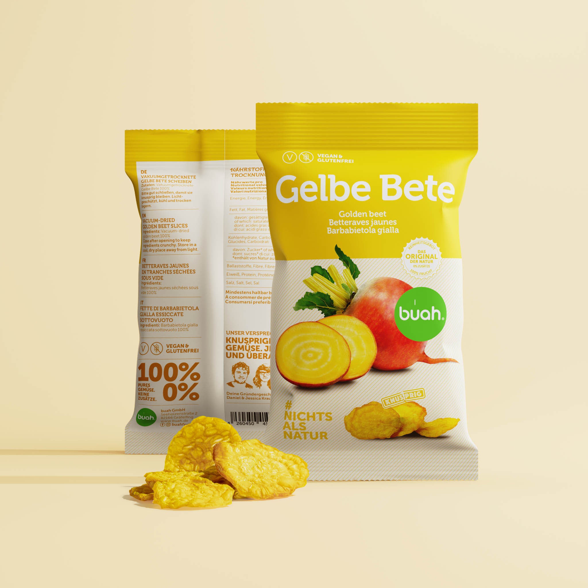 Zwei Packungen buah gelbe Bete mit Vorder und Rueckansicht und einem Haufen gefriergetrockneter Gelber Bete