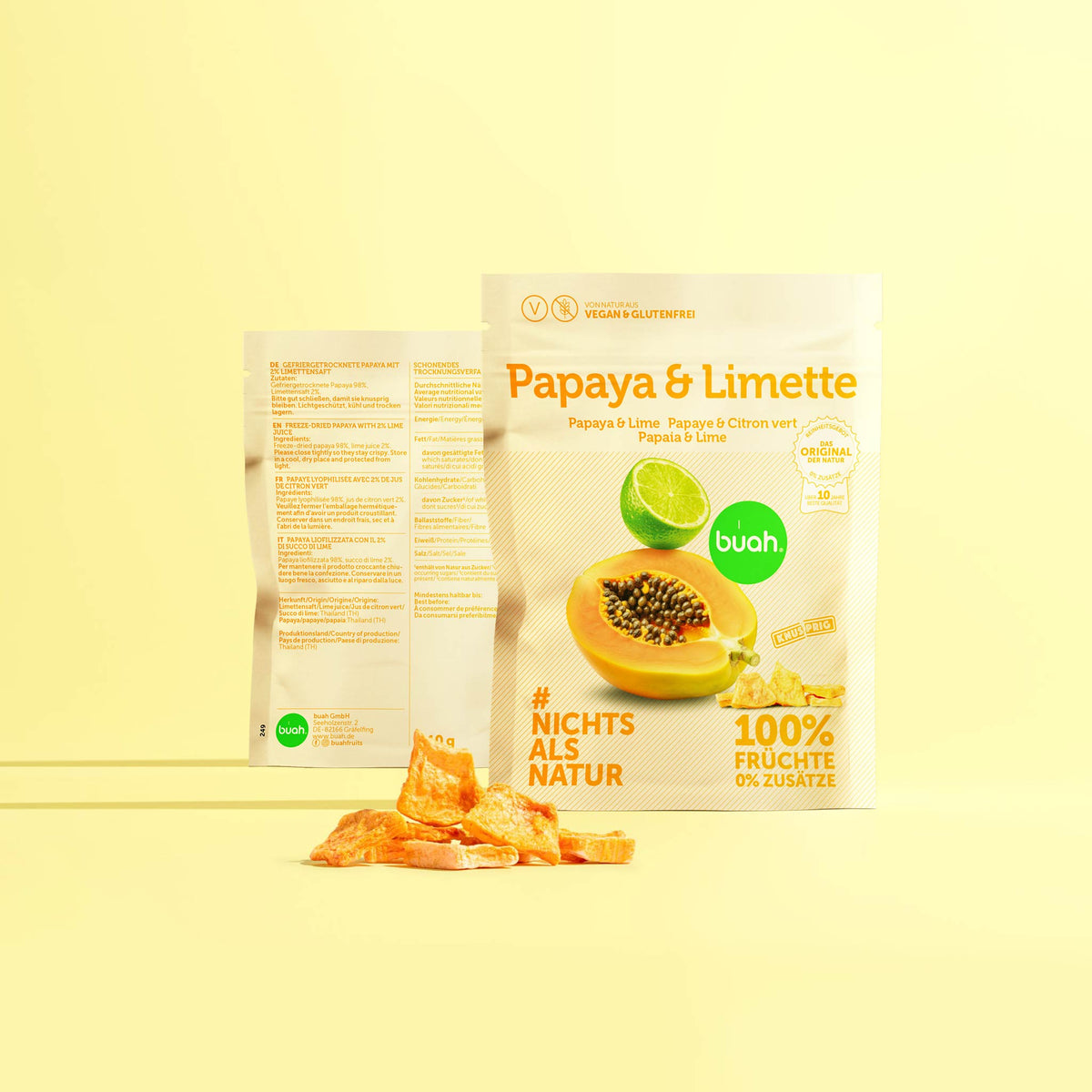 Kleines rechteckiges Päckchen mit Abbildung einer Papaya, aufgeschnitten und mit einer Limette. Schriftzug in Orange. 